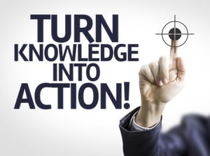 Business man pointing to transparent board with text Turn Knowledge Into Action!.jpeg