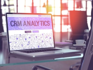 CRM Analytics - Closeup Landing Page in Doodle Design Style on Laptop Screen. On Background of Comfortable Working Place in Modern Office. Toned, Blurred Image. 3D Render..jpeg